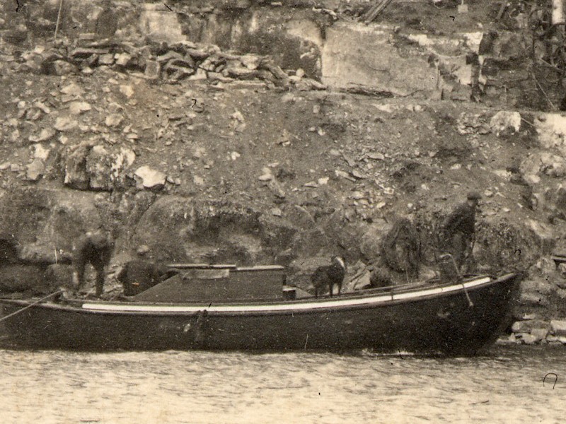 Detail showing the men in the boat ... and their dog