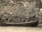 Detail showing the men in the boat ... and their dog
